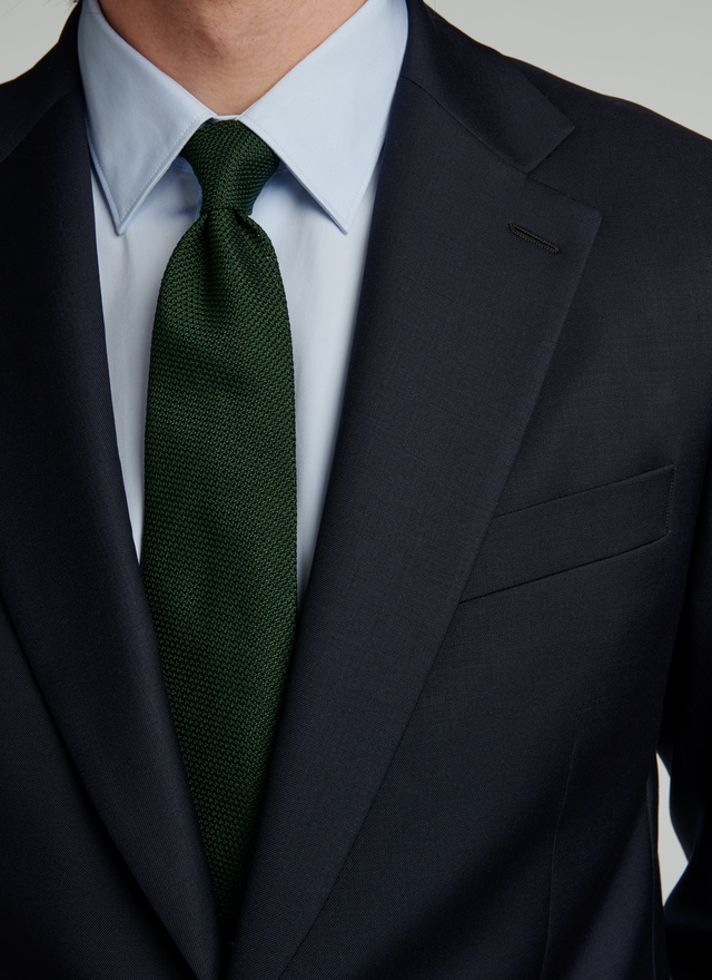 black suit with dark green shirt